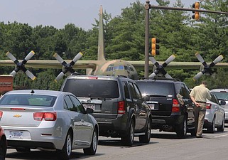 A line of cars wait outside the main gate of the Little Rock Air Force Base in Jacksonville in this 2014 file photo. (File - Arkansas Democrat-Gazette/Staton Breidenthal)